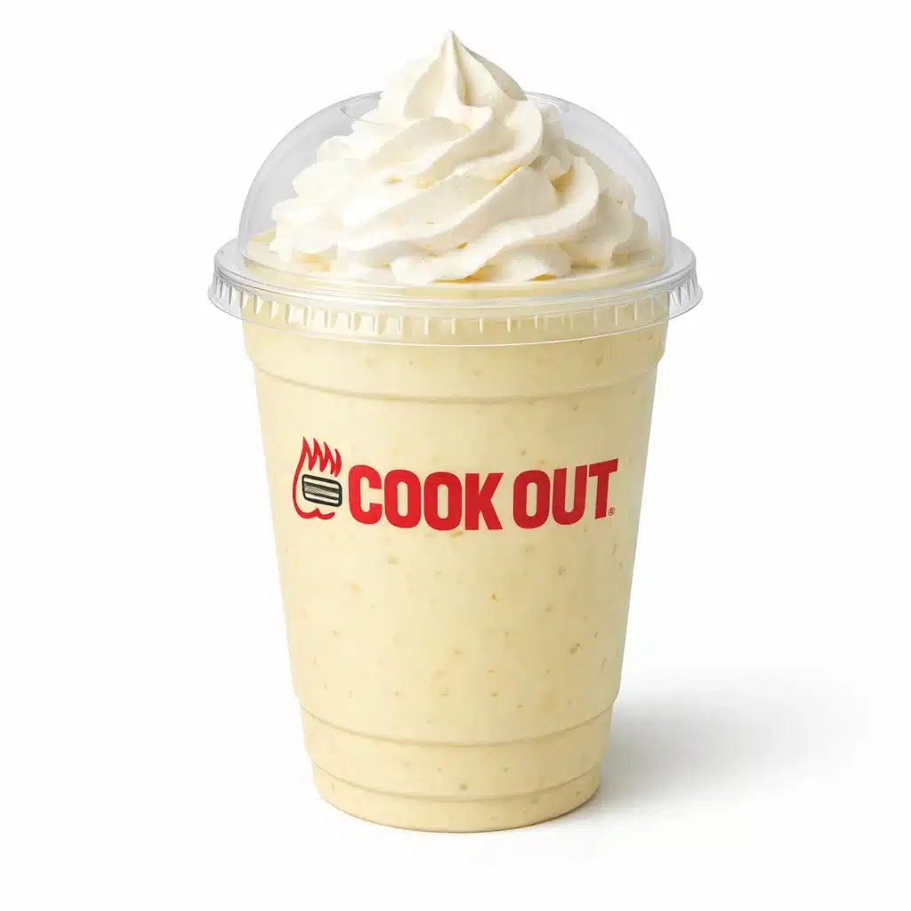 Banana milkshake in Cookout cup with dome lid and whipped cream