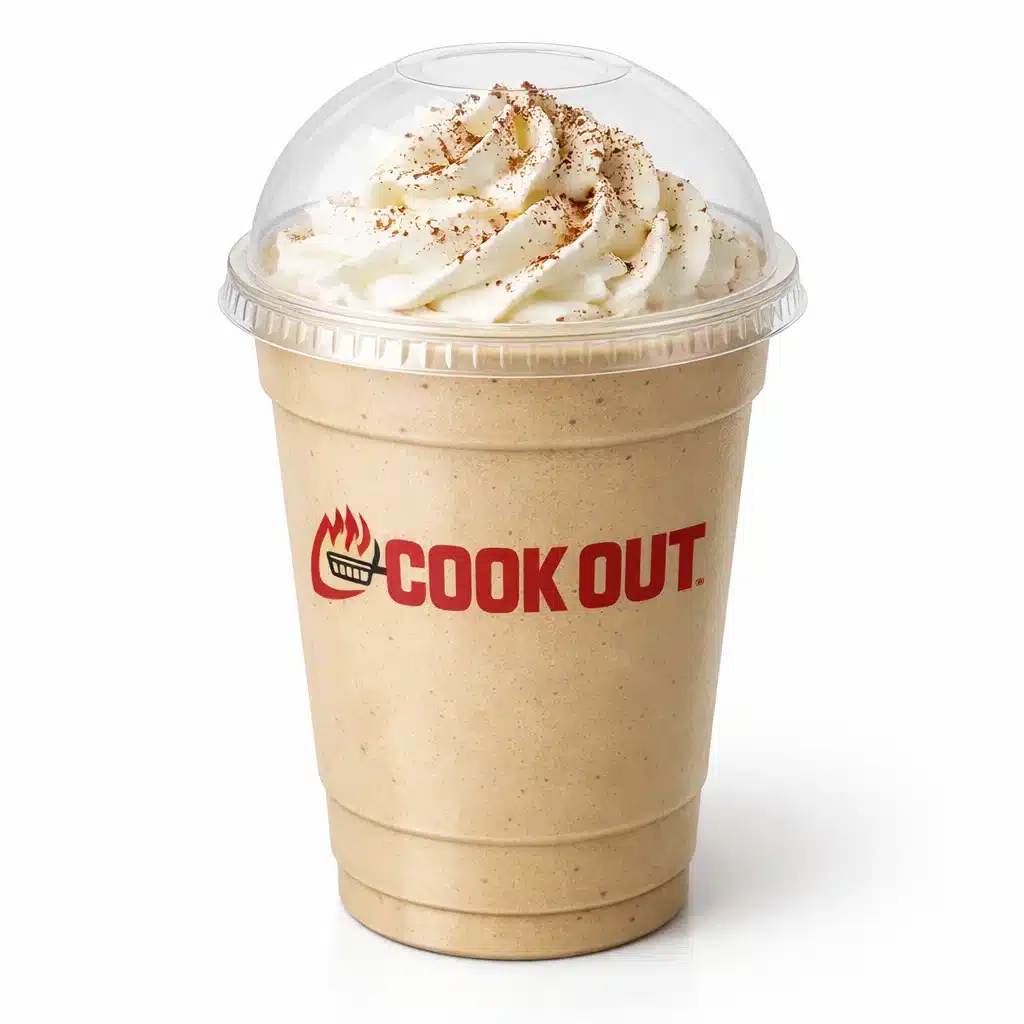 Cappuccino Milkshake in Cookout dome cup with whipped cream and cocoa powder